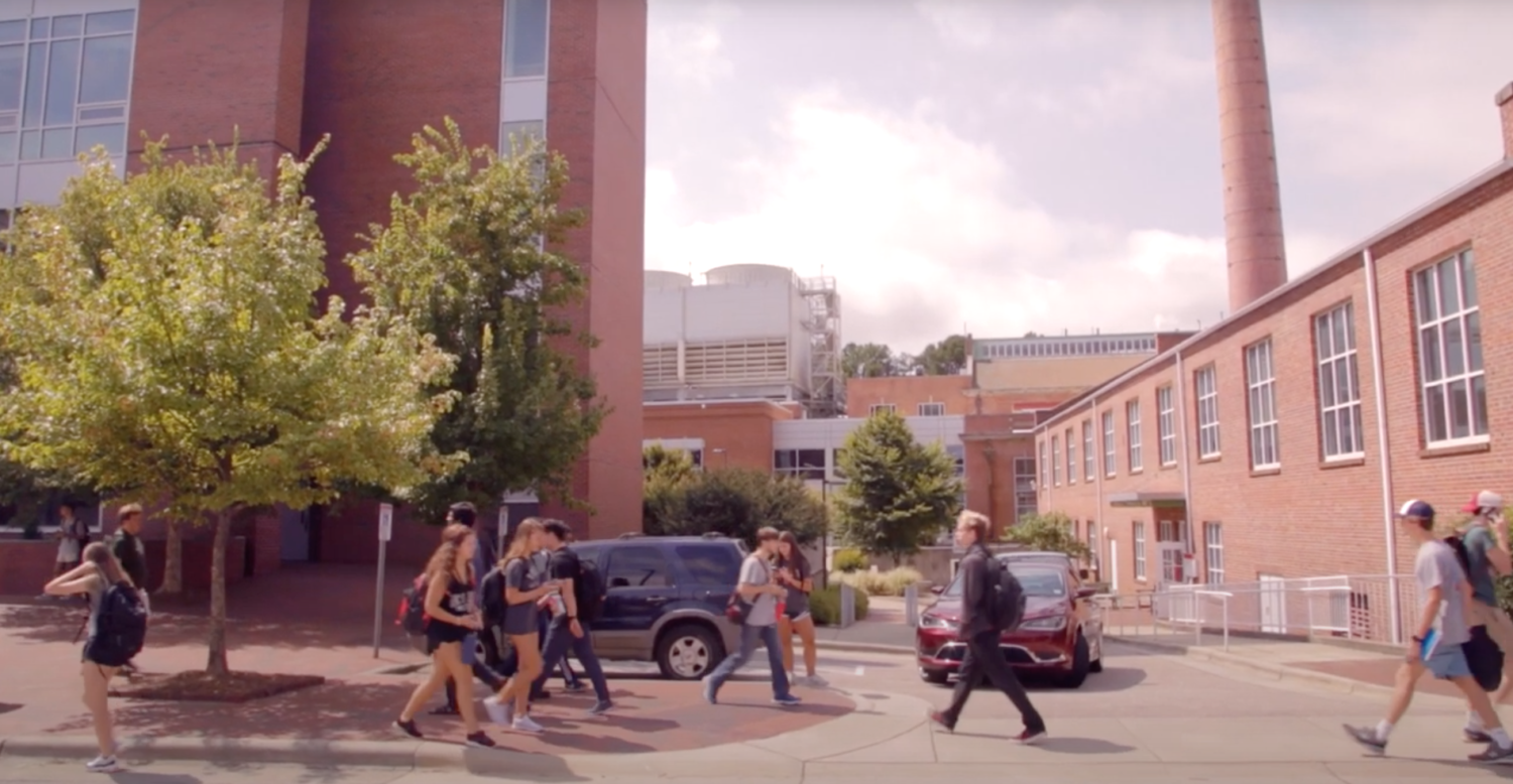 Students walk across campus near SAS Hall