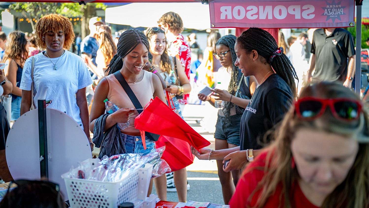 A student explores a vendor booth during Packapalooza.