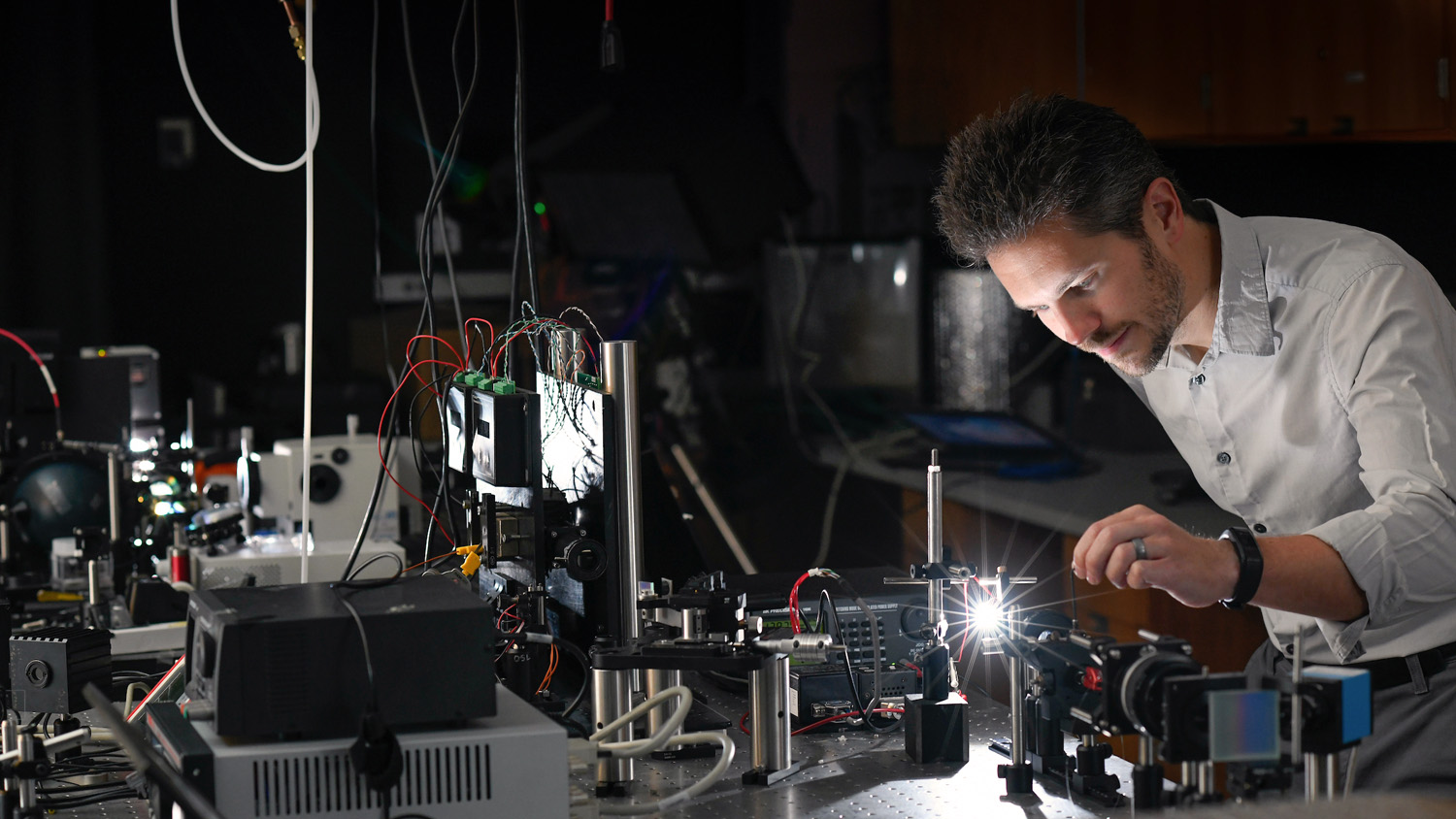A man works in the optical sensing lab in the Monteith Research Center at NC State.