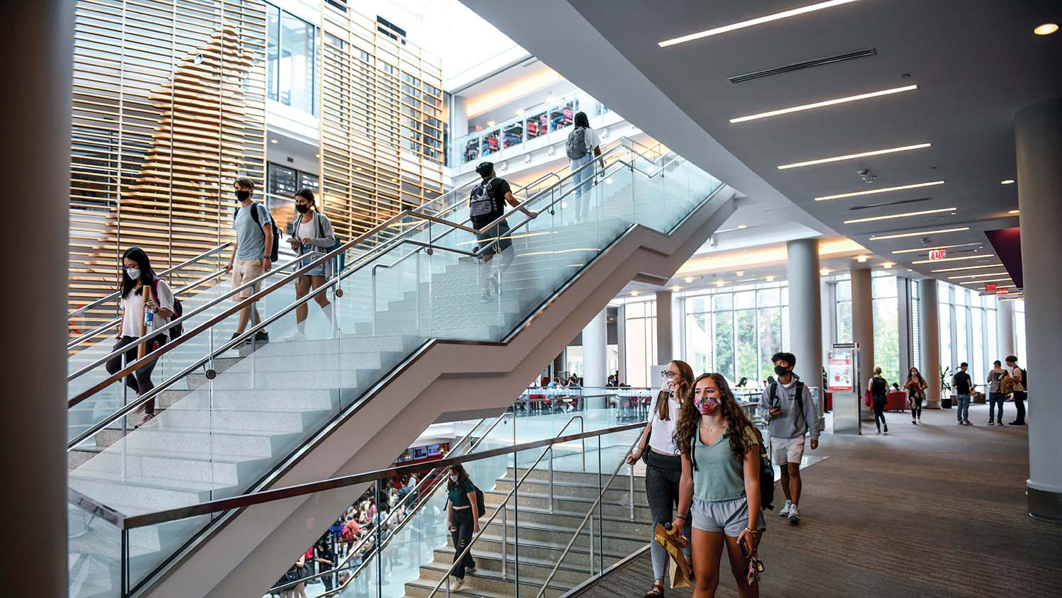 Students walk between floors in a crowded Talley Student Union.
