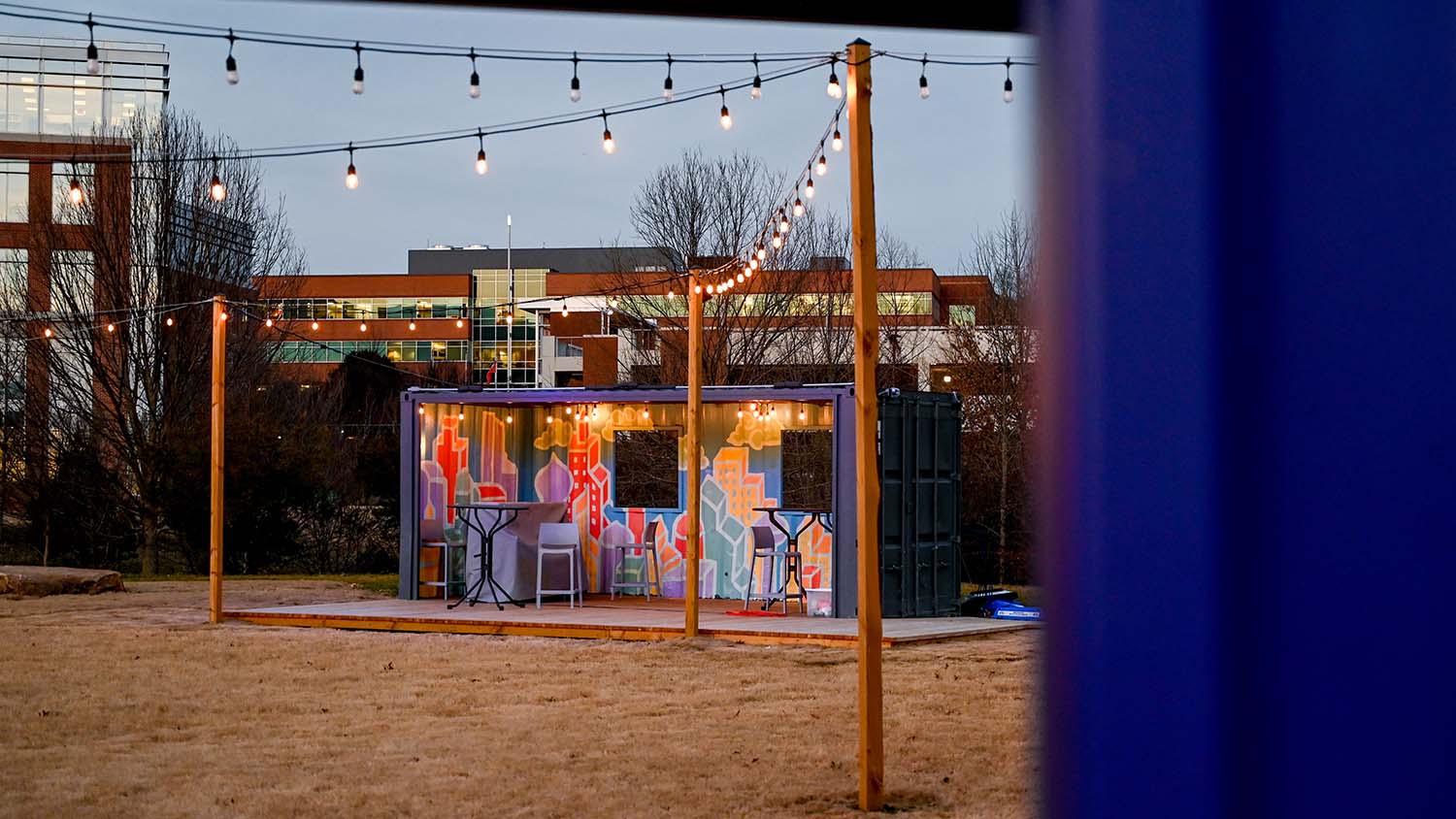 A colorful mural in the interior of one of the shipping containers.